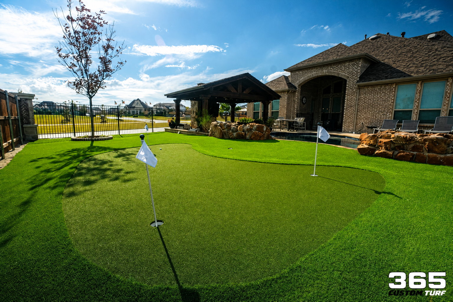 Turf lawn with stone pathway and landscaping