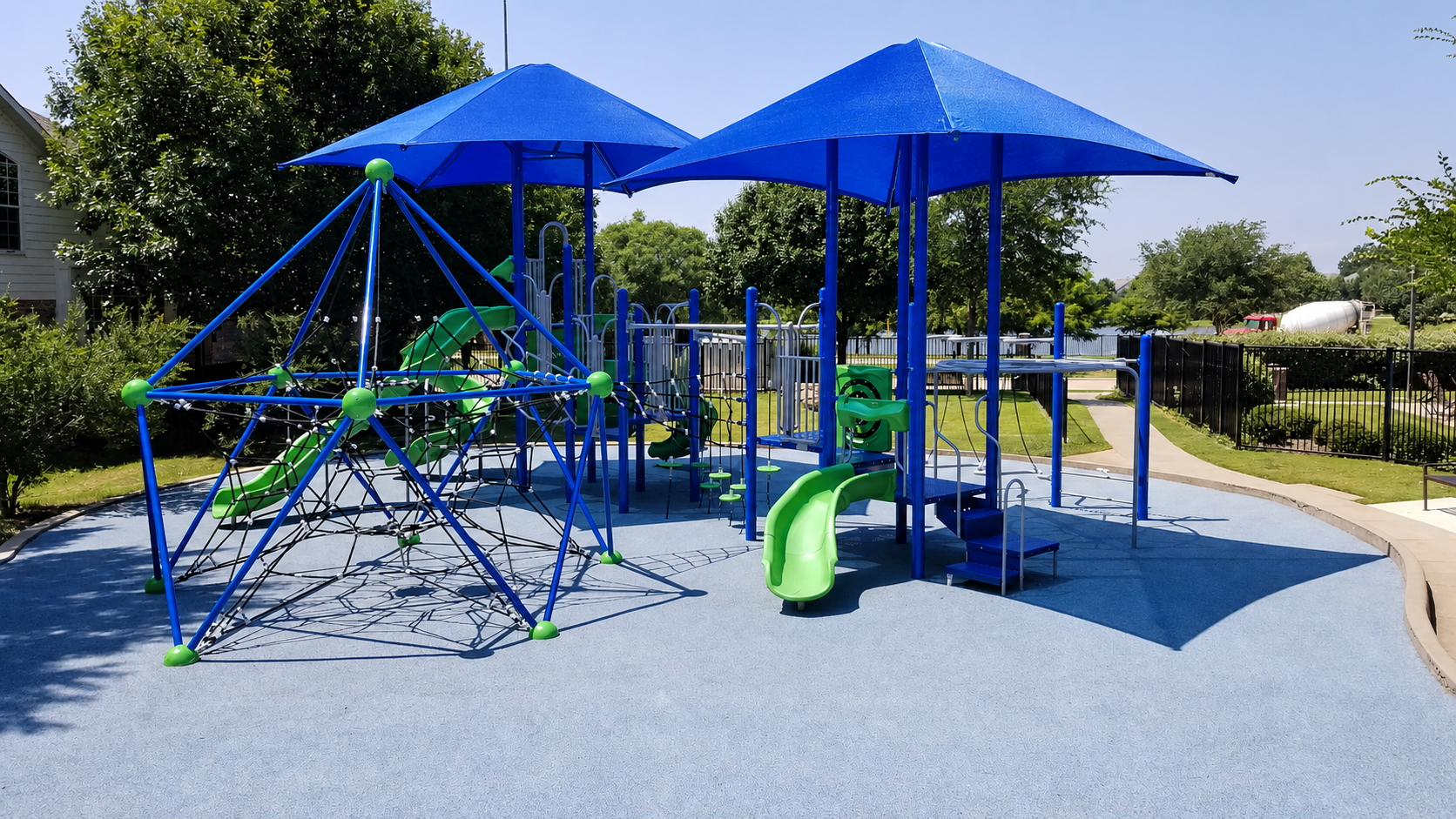Playground with blue shade covers and rubber surface