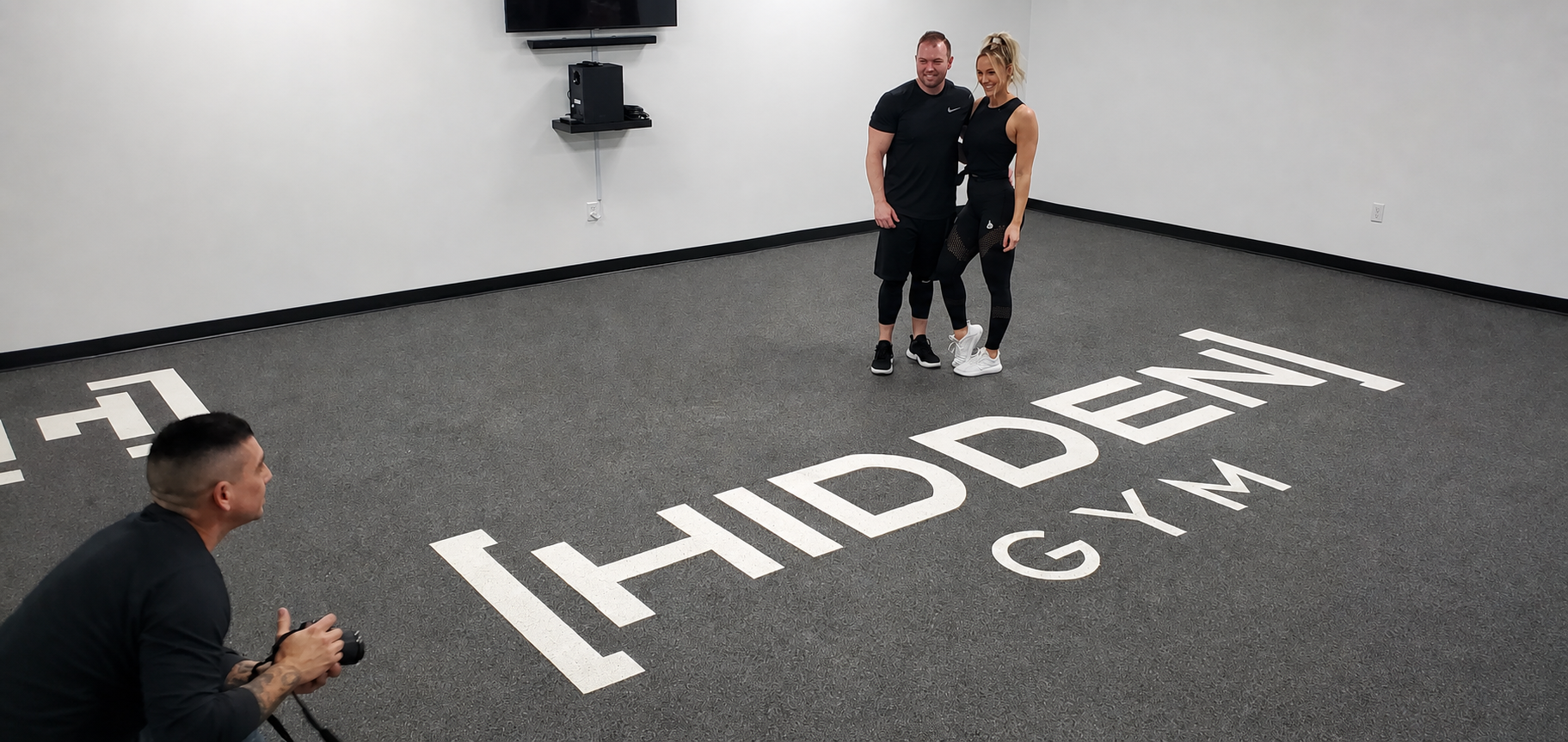 Hidden Gym rubber floor with custom logo