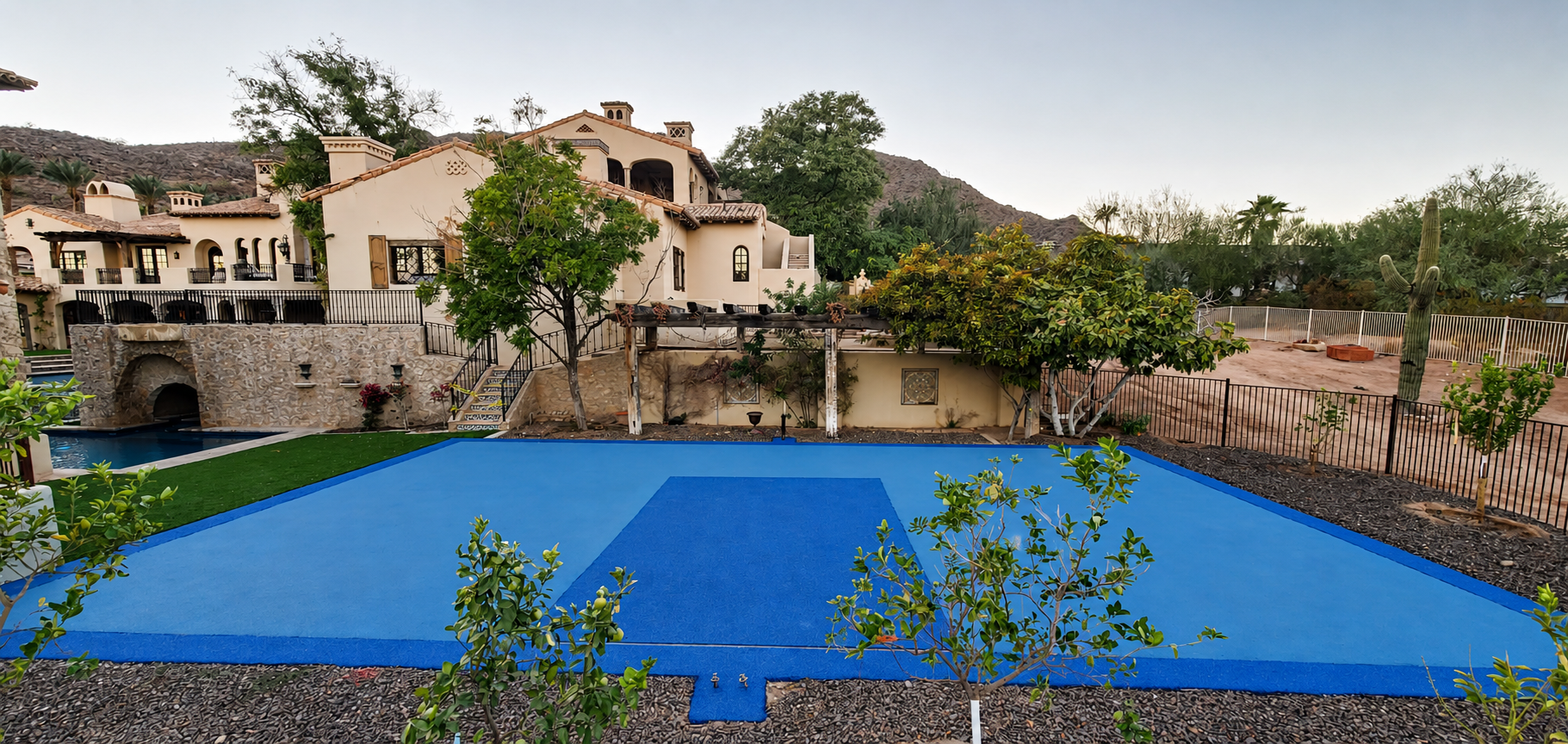 Blue rubber court with mountain backdrop