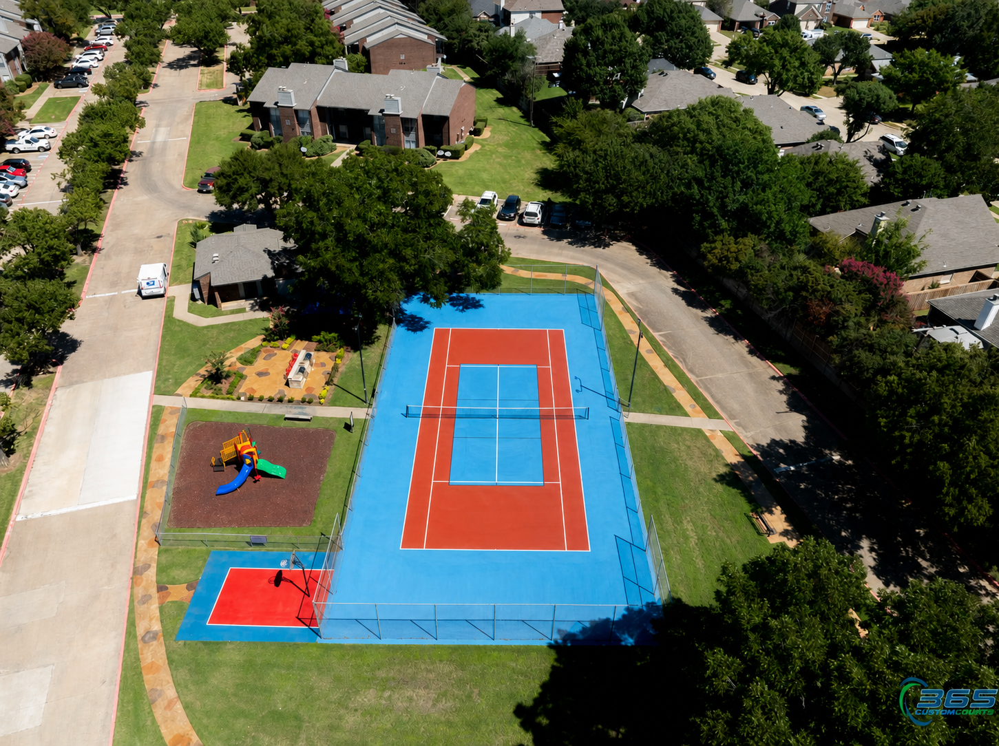 Community tennis court with playground