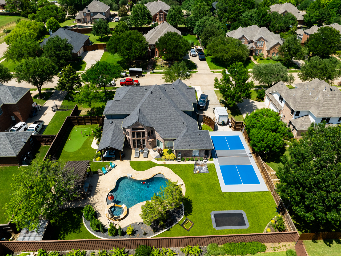 Backyard with pool, pickleball courts, and putting green