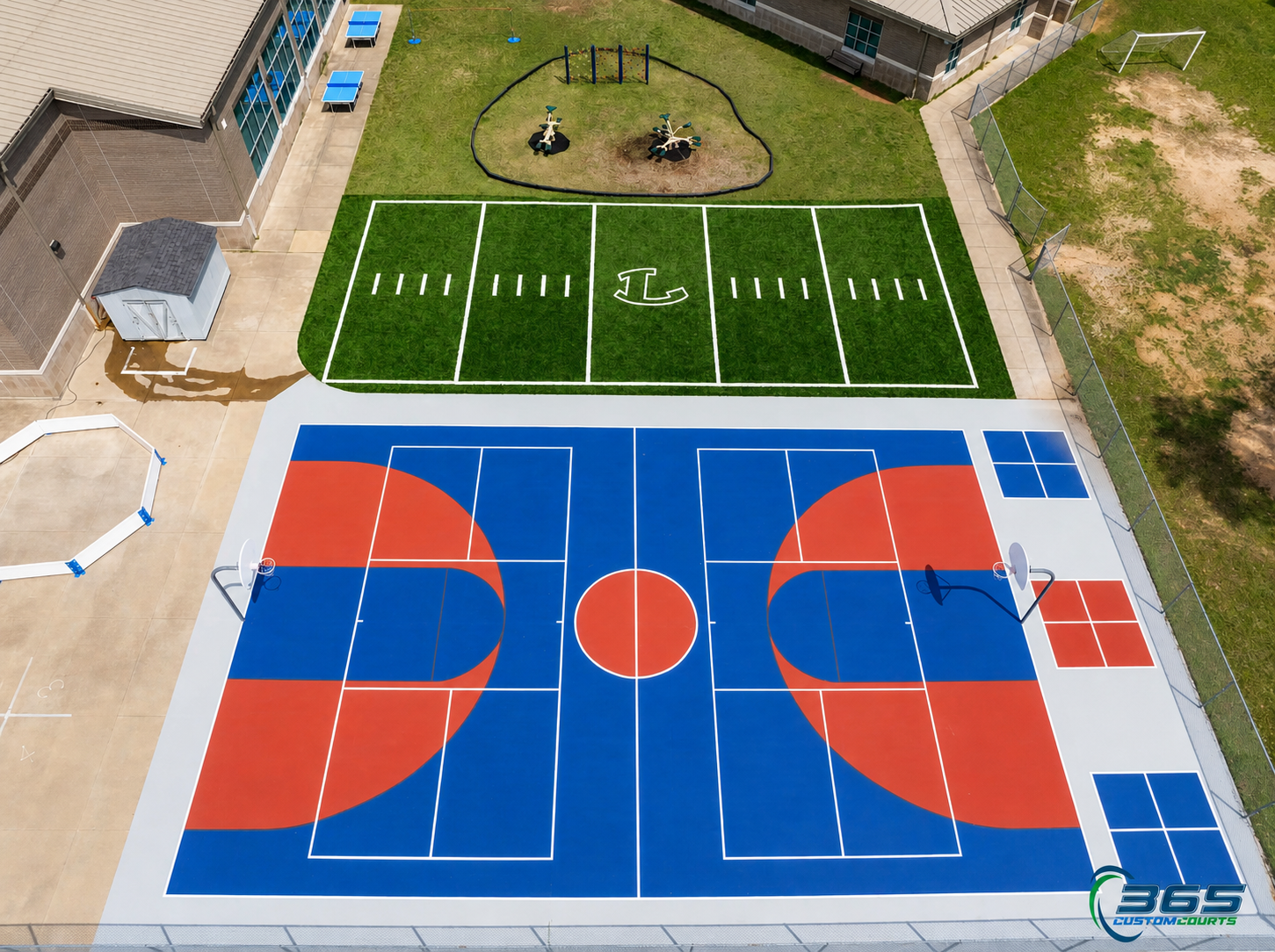 School sports complex with basketball court and football field