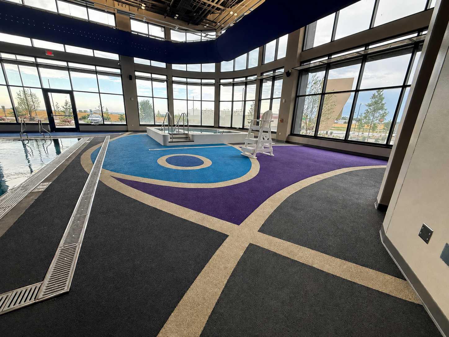 Indoor aquatic center with decorative rubber surfacing
